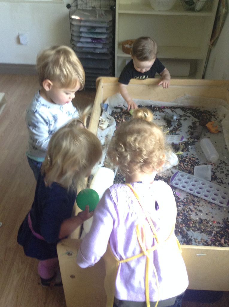Toddlers at sensory bin
